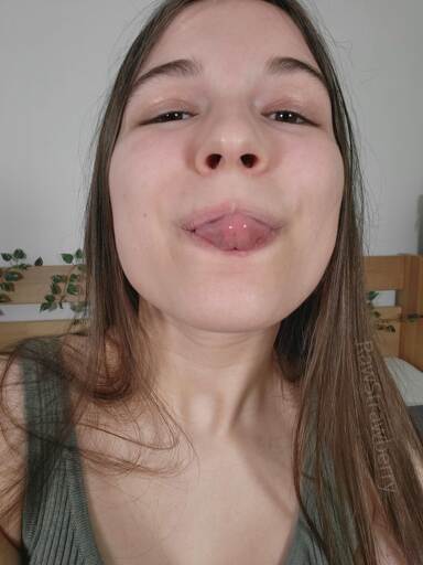 RawStrawberry taking a silly selfie, making a goofy blep face.